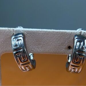 Silver tone huggie earrings